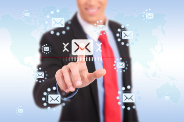 Businessman pressing messaging