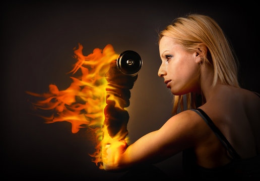 Woman lifting a weight on fire