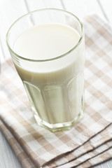 glass of milk on wooden table