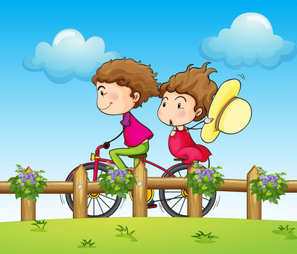 A couple riding a bicycle