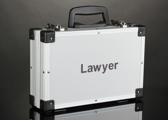Silvery diplomat (suitcase) on grey background