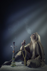 sexy woman smoking the hookah