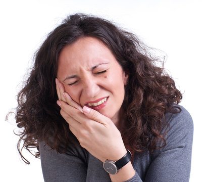 Young woman suffering from a toothache