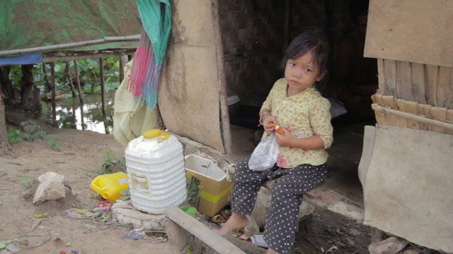 cambodian kids in slums near phnom penh city dumping area