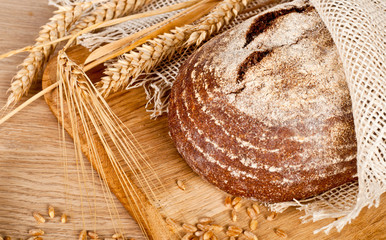 Fresh baked traditional bread and wheat