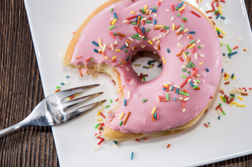 Single Pink Donut on a plate