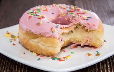 Single Pink Donut on a plate