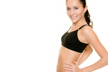 Sporty woman in the stuido in front of white background