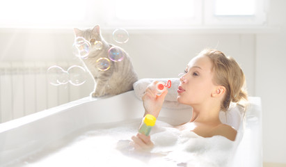 An Attractive girl relaxing in bath