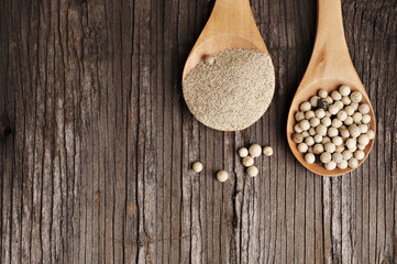 White pepper in wooden spoon