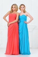 Fototapeta na wymiar Two beautiful women in evening dresses