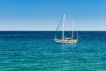 Fototapeta premium Sailing yacht on the calm sea