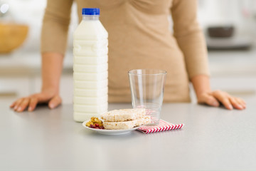 Closeup on breakfast of young woman in kitchen