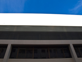 Building exterior wall and metal vertical fins as background