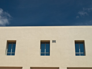 Facade windows of office building on blue sky