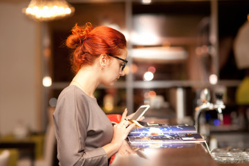 Businesswoman on a coffee break, using tablet computer  - 49447775