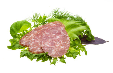 Sausages with salad and basil