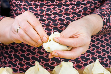 woman making dumplings
