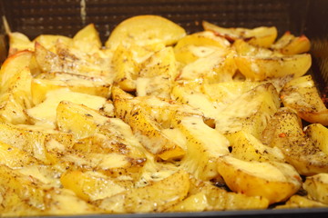 Roasted potatoes with spices and cheese