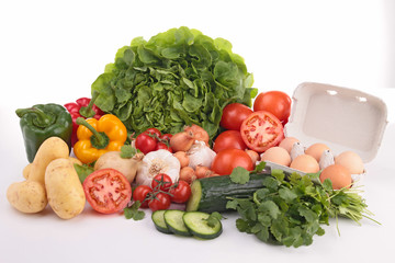 heap of vegetables and egg isolated on white