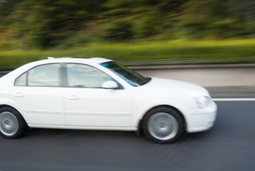 Fototapeta na wymiar Motion blurred car