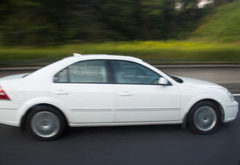Fototapeta na wymiar Motion blurred car