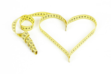 Tape measure heart shape - health, weight concept