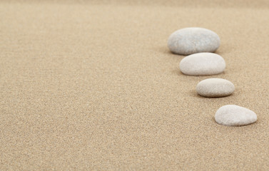 zen stones in sand
