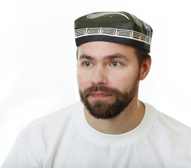 Man with a beard in the skullcap.
