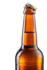 Open bottle of beer with drops isolated on white