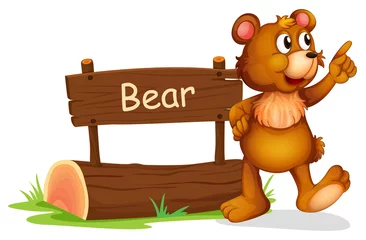 Fototapeten Ein Bär steht neben einem Holzbrett © GraphicsRF
