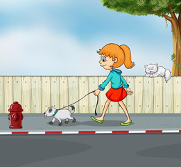 Une fille se promenant avec son animal de compagnie