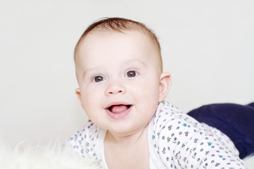Portrait of the five-months laughing baby