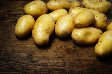 potatoes on an old wooden table