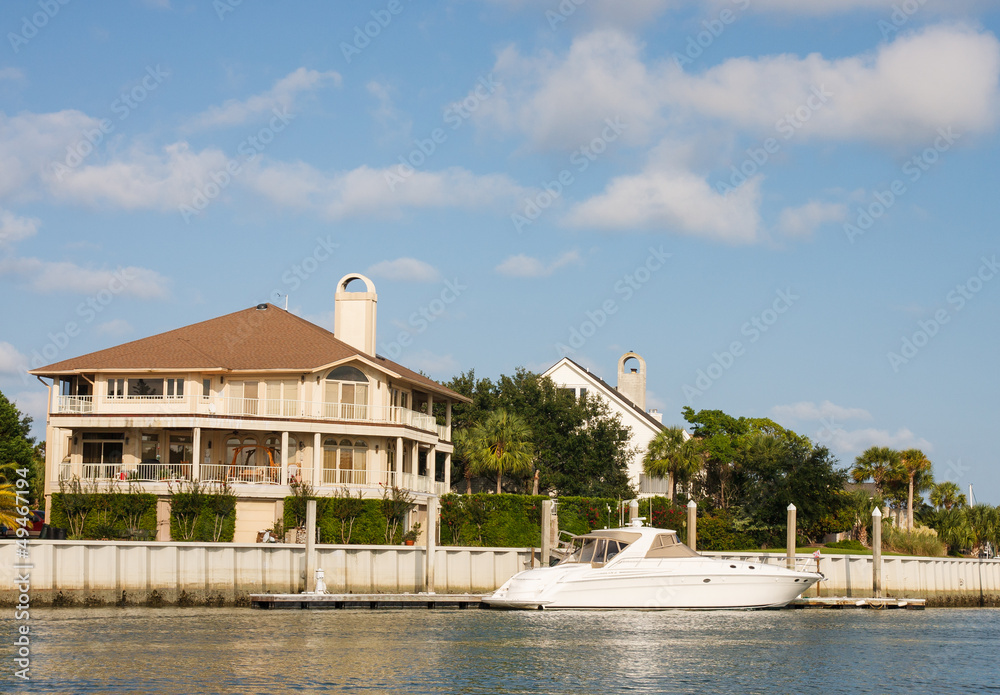 Wall mural Nice Home on Channel with Small Yacht