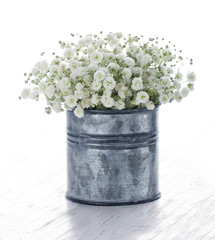 Bouquet of white gypsophila on wooden background