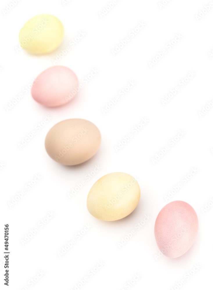 Wall mural Semicircle of multicolored hen's eggs, isolated on white