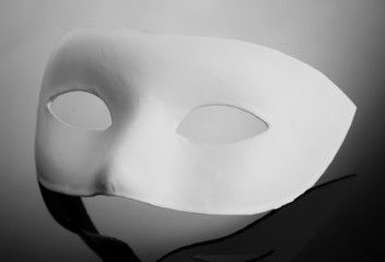 White mask, on grey background