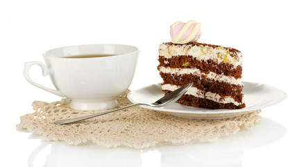 A cup of tea and delicious cake isolated on white