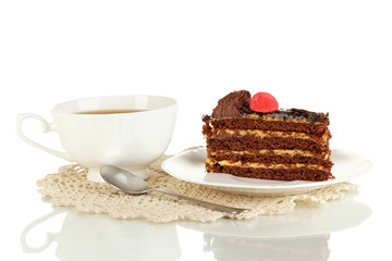A cup of tea and delicious cake isolated on white