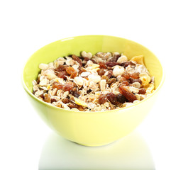 Delicious and healthy muesli in bowl isolated on white