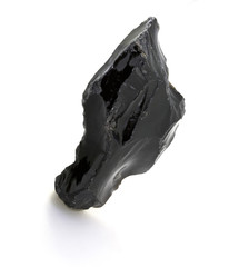 Raw black spinel isolated on a white background