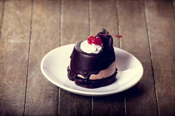 Cherry cake. Photo in old vintage color image style. Focus on ch