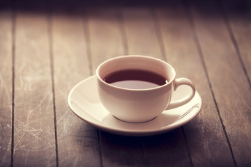 Cup of tea in vintage colour style.