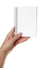 Hands holding white notebook
