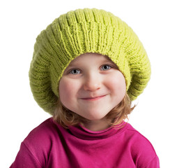 Happy little girl in a knit cap