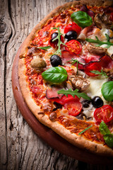 Delicious italian pizza served on wooden table