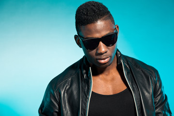 Obraz premium Cool urban stylish black american man. Fashion studio shot.