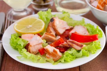 salad with fish on the white plate