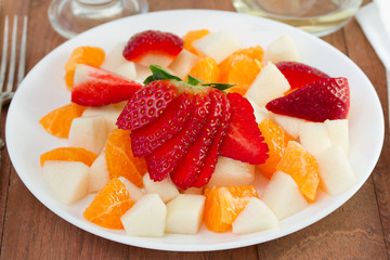 fruit salad on the white plate